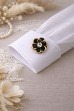Cache bouton fleur noire