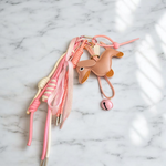 Grigri chien rose